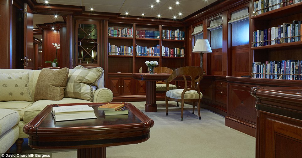 There are plenty of spots for guests to unwind across the vessel's three levels of living space. Wall-to-wall bookshelves can be found in this library area, above