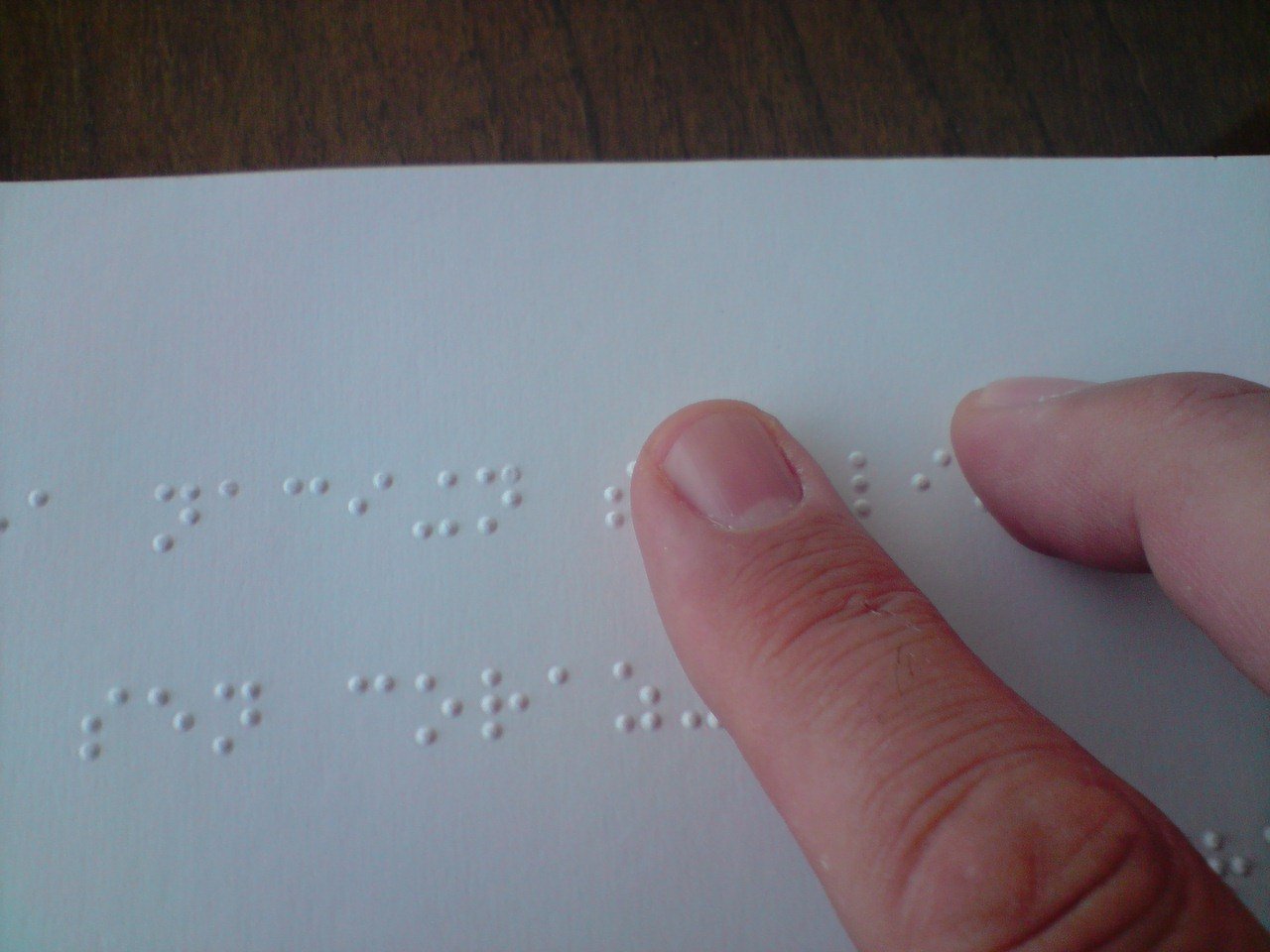 a person reading a braille book 10 inventions you probably didnt know were made by kids (10 Photos)
