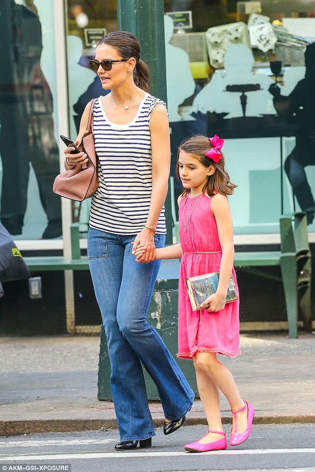 Where's dad? Suri Cruise - pictured with mom Katie Holmes in NYC on her 10th birthday, April 18 - hasn't seen or spoken to her father Tom Cruise in more than two and a half years, In Touch Weekly is reporting
