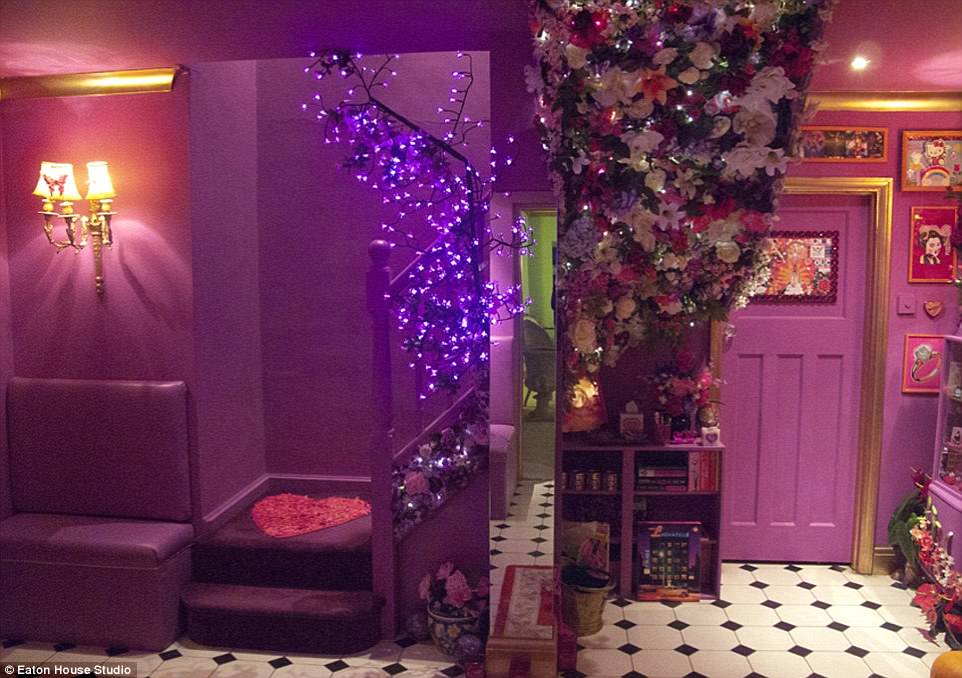 The so-called purple flower stairway complete with heart-shaped doormat and flower-adorned feature wall