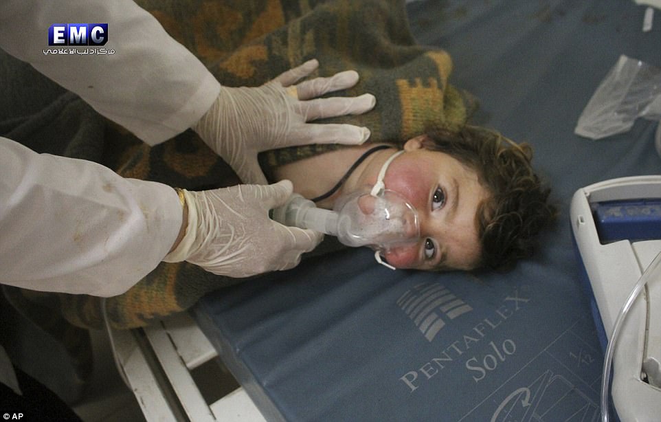  Up to 100 people have died from suffocation after a toxic gas attack in the town of Khan Sheikhoun, in the rebel-held central province of Idlib, Syria, early Tuesday morning. Pictured above, a child gets treatment at a hospital after Assad Regime forces attacked