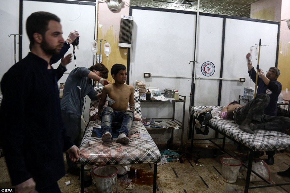 An Injured child receives treatment in a field hospital after airstrikes by forces allegedly loyal to the Syrian government, rebel-held Douma on Tuesday