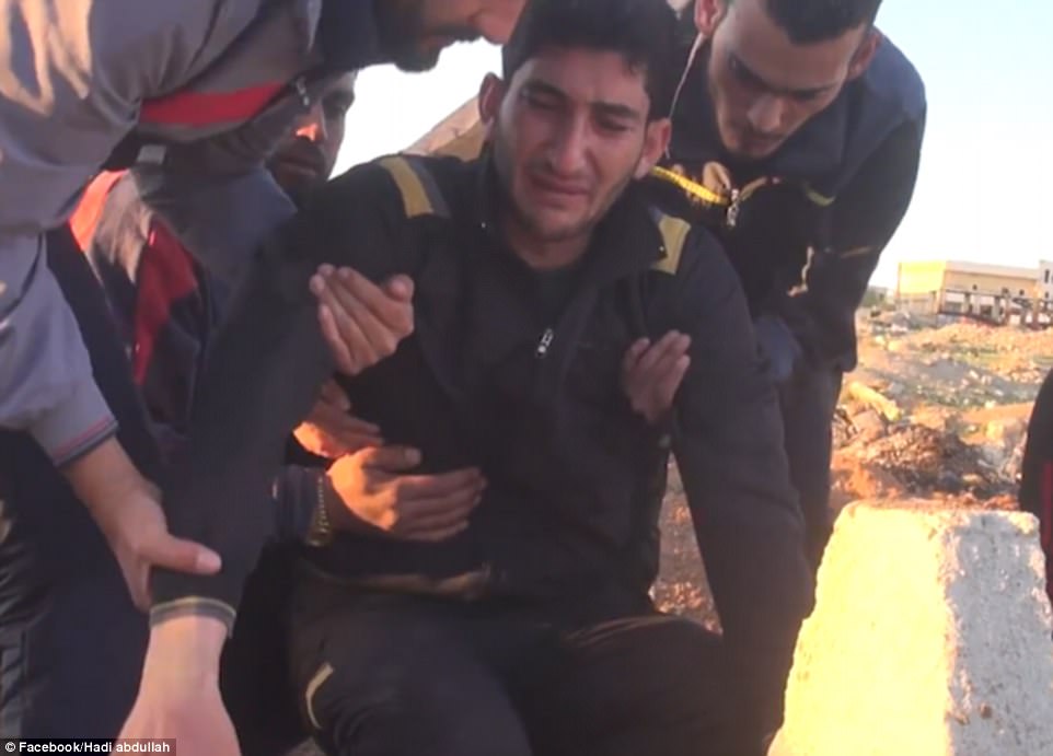 'My children. My children. They were beautiful,' Abdul, 29, screams in harrowing footage of his visit to his young family's graves. His friends have to hoist him onto his legs and wipe the tears from his face as he clings to the dirt around their graves