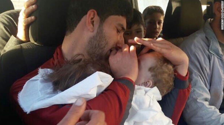 Youssef holds his twins, who were killed in Tuesday&#39;s chemical attack.
