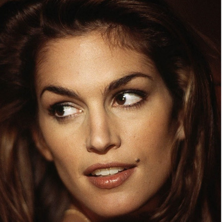 The most famous person with a mole sitting by the end of the lips may be Cindy Crawford. 