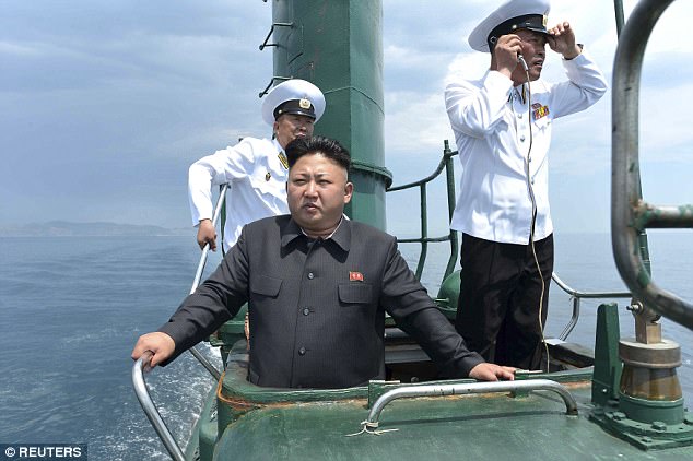 Kim Jong-un (pictured in 2014) is increasing his underwater military capabilities and may even have plans in place to launch nuclear missiles from a submarine, it has been claimed