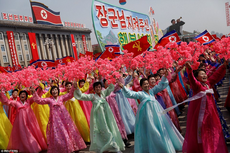 Women wearing traditional outfits looked jubilant as they passed by despot leader Kim Jong-un at the parade in Pyongyang