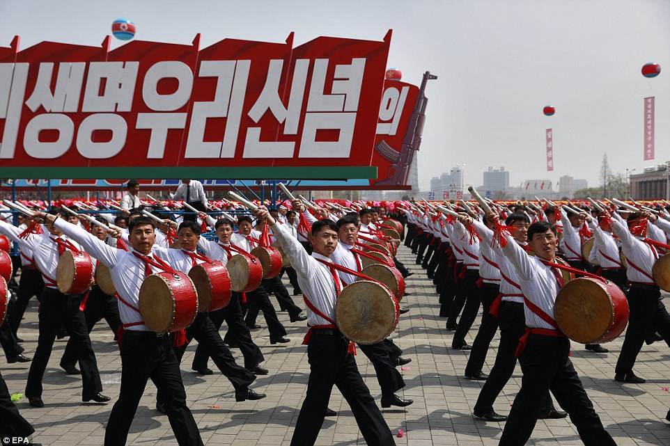 Performers play the drums at the parade today, where North Korea gave a show of its military might in Pyongyang
