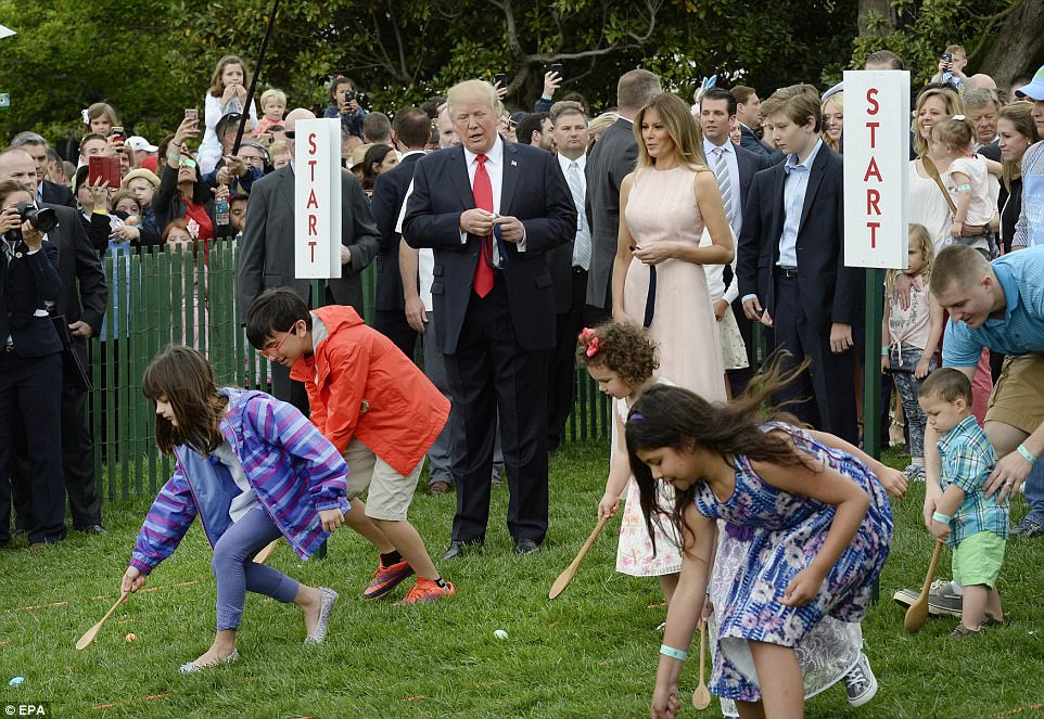 President Trump joined in the festivities on the South Lawn, cheering on children taking part in the traditional roll with wooden spoons 