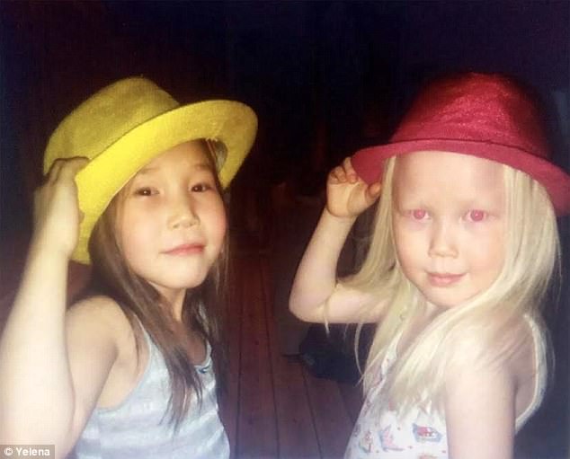 Pictured with a cousin, Nariyana looks different due to her 'porcelain skin' and blonde hair 