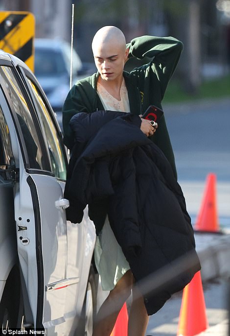 Transformation: The 24-year-old gave fans a glimpse of her starkly different shaven head for the first time as she arrived on set in Toronto, ahead of another busy day shooting