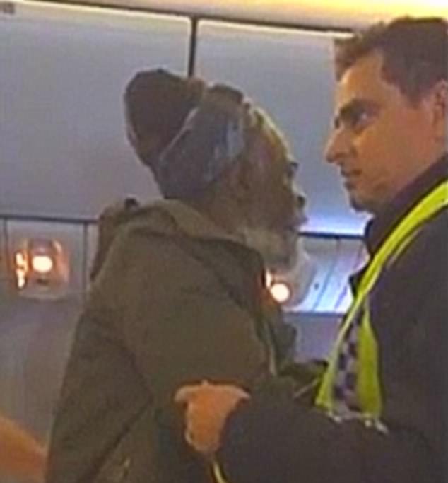 Dramatic footage shows the moment  British cancer and diabetes sufferer Kwame Bantu, pictured, was thrown off a BA flight by police after trying to stretch his legs in business class
