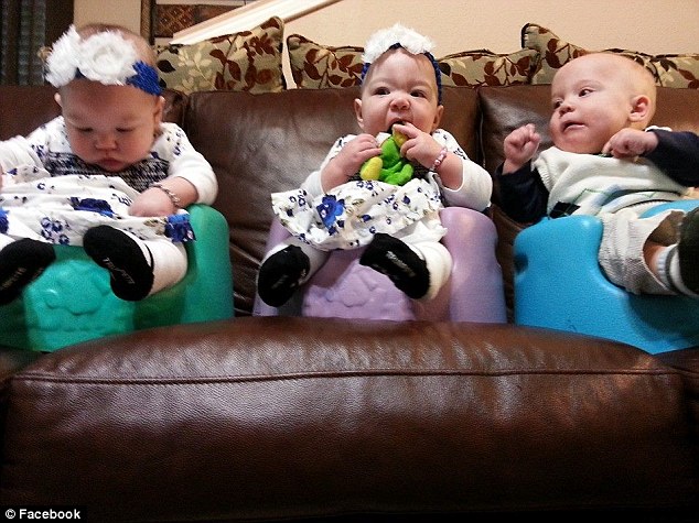 No regrets: Sarah said even if they knew they'd have their own biological children, they'd never give up their triplets, pictured