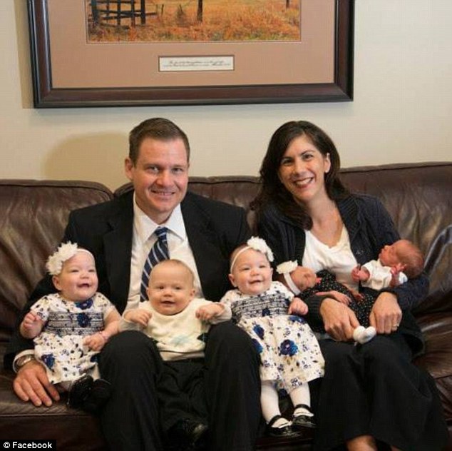 Big family: Tulsa, Oklahoma, couple, Sarah and Andy Justice, pictured wit their brood, have gone from zero children to five in less than a year after they adopted triplets then fell pregnant with twins.