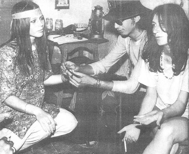 17 -  Pakistani hippies rolling up a joint in Karachi, 1973.