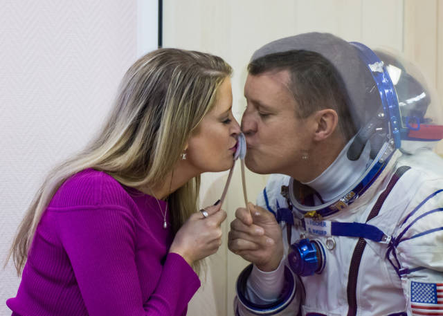 28 -  NASA’s Jack Fischer kissing his wife Elizabeth goodbye through glass as he’s quarantined before flying to space.