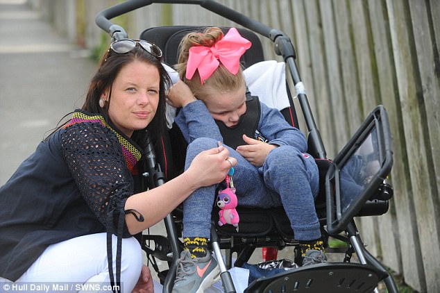 Ms Grant is convinced that tuna has left daughter Lexi, 8, unable to walk and talk