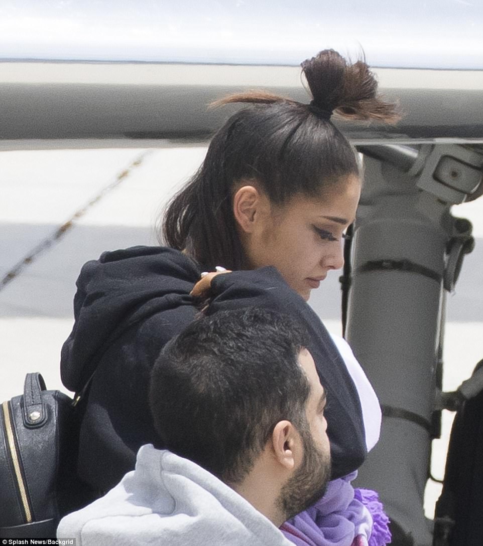 Touching down: The 23-year-old pop star and her mother Joan exited a private plane after arriving in Boca Raton, Florida
