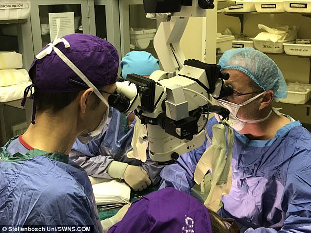 Professor André van der Merwe, head of Stellenbosch University's urology department led the lengthy operation and spoke of the color discrepancy. He said: 'The patient is black, and the donor was white. 'We have very few donors for this transplant procedure. But that is the only issue left'  