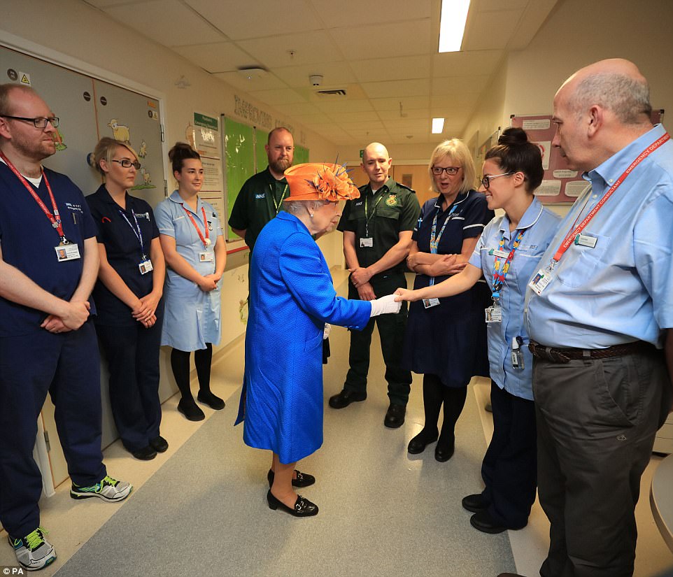 Shaking hands with heroes: The Queen thanked some of the paramedics and staff at Royal Manchester's Children's Hospital who worked tirelessly to help the youngsters injured in Monday's attack. Five remain in critical care at the hospital