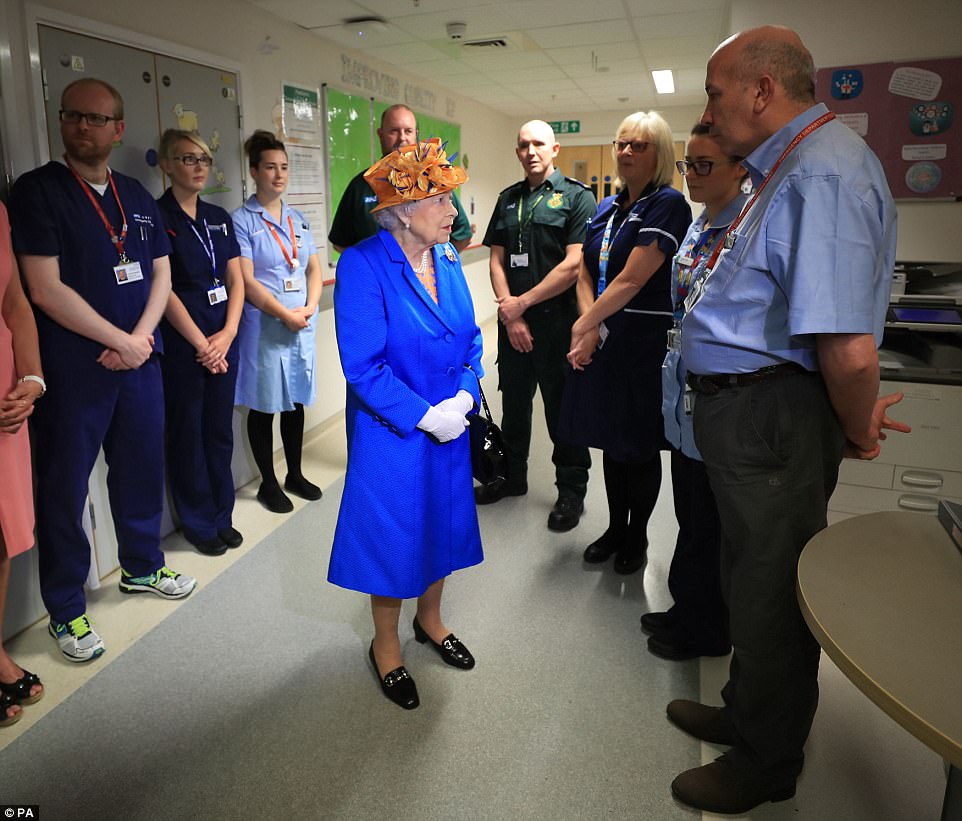 Giving thanks: The Queen stopped to speak to hospital staff during her tour of the hospital