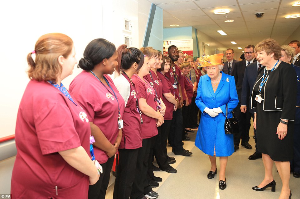 Personal touch: The Queen spent time learning the role each medic and hospital worker had played in the aftermath