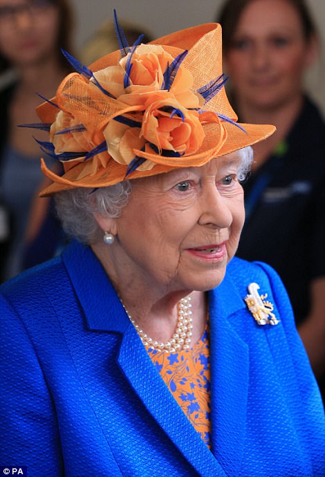 Vibrant: The Queen opted for an electric blue coat, printed dress and orange hat