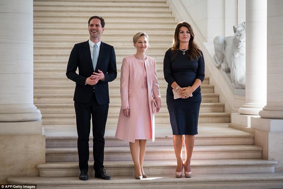 First Gentleman of Luxembourg Gauthier Destenay, partner of Slovenia's Prime Minister Mojca Stropnik and First Lady of Iceland Thora Margret Baldvinsdottir pose for a photo 