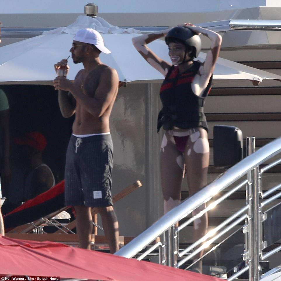 Rumoured couple: Winnie flashed a big smile as got ready for a jet ski ride with her sports mad rumoured beau