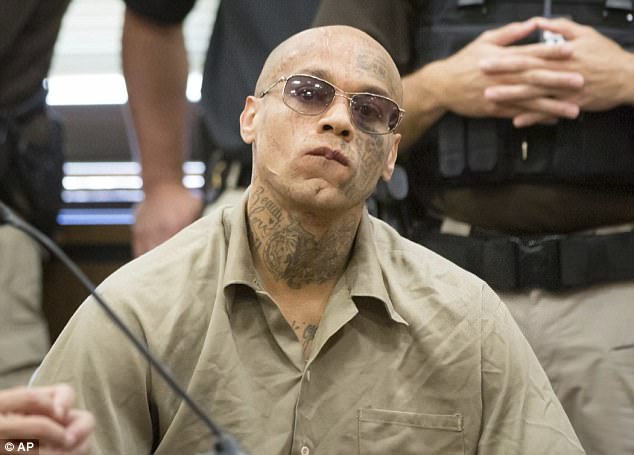 Nikko Jenkins, 30, showed no emotion as he was handed the death penalty sentence on Tuesday for murdering four people in a brutal Nebraska shooting spree in 2013 (pictured in court on Tuesday)