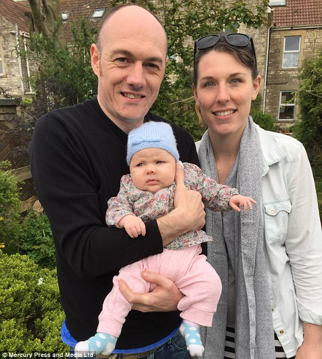 Teaching him a lesson: New mother Liz Hicks, 27, wanted to show partner Ross Casey, 35, the reality of breastfeeding. Pictured, the parents with their infant daughter Sydney