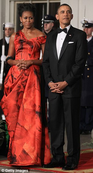 But she said the former president easily got away with wearing the same outfit every year to state dinners. Above the couple is pictured at the state dinner in January 2011