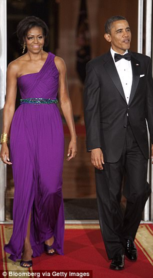 Obama said: 'This is the unfair thing — you talk about Fred Astaire and Ginger Rogers — no matter what we do, he puts on that same tux.' Above the couple is pictured at the state dinner in October 2011